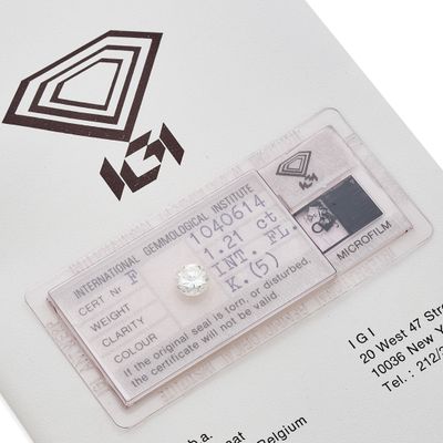 a white card with a diamond on top of it