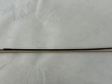 a close up of a black and white stick on a white surface