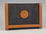wallet with a black and brown design on the front of it