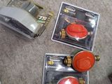 three different types of fire extinguisors on the floor