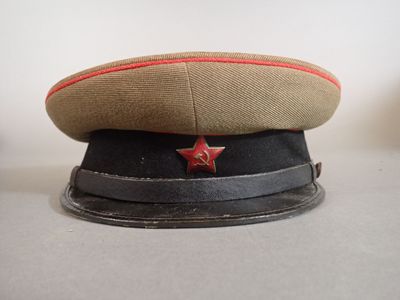hat with a red star on it sitting on top of a table