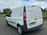 a white van that is parked on the side of the road