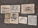 several pieces of old paper with stamps on them on a table