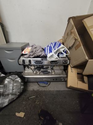 a pile of boxes and other items on the floor