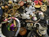 a pile of assorted jewelry sitting on a table