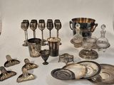 a lot of silver items that are on the table