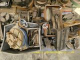 a pile of assorted metal items sitting on the floor