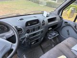 a dashboard of a vehicle with a steering wheel and dashboard controls