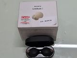 a box with a pair of black sunglasses in it