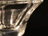 close up of a clear glass bowl on a black surface