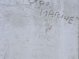 graffiti on the wall of a building in the middle of a city