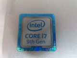 an intel core i7 9th gen processor on a white surface