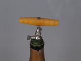 a close up of a bottle with a cork on it
