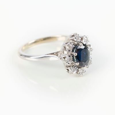 an oval sapphire and diamond cluster ring in white gold