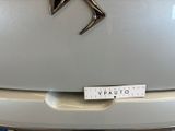 a sticker on the back of a car that has a logo on it