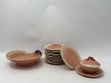 a lot of plates and bowls that are sitting on a table