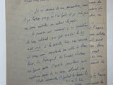 an old piece of paper with writing on it sitting on a table