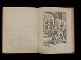 an open book with a drawing of a group of people on it