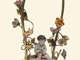 a figurine of a cat sitting on a table