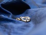a pair of scissors laying on a blue cloth