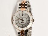 an image of a close up of a wrist watch on a white surface