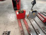 a fork lift truck and a fork lifter in a warehouse