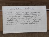 a note written on a piece of paper on a piece of wood