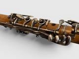 a close up of a musical instrument on a white surface