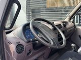 a car that has a steering wheel and a clock in it