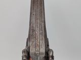 an old wooden vase sitting on top of a wooden table