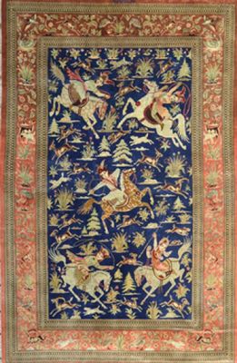 un tapis bleu et rouge orné d'oiseaux et de fleurs