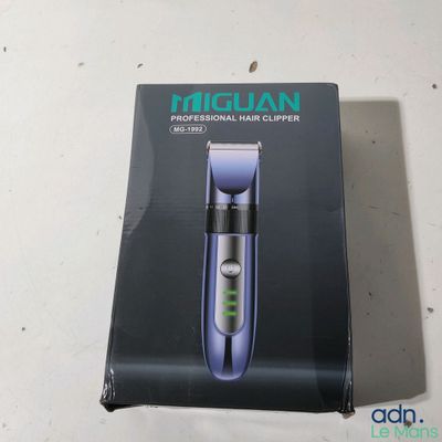 a box with a hair clipper in it on a table