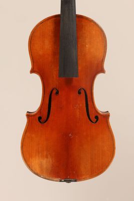 an old violin with a bow hanging from it ' s back