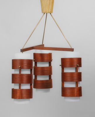a close up of a chandelier made of wood and glass