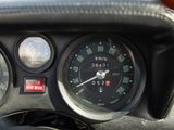 a close up of a dashboard with a speedometer and gauges