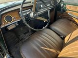 a brown leather seat in the front of a car