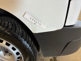 a close up of a white truck with a sticker on it ' s side
