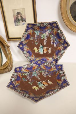 two plates that are sitting on a table next to a mirror