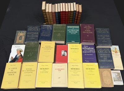 several books are stacked on a table with a black table cloth