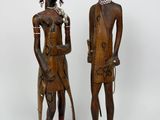 pair of african carved wooden figures of a man and a woman