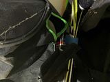 a black bag with a pair of skis and a pair of gloves