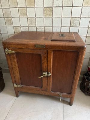 a small wooden cabinet with two doors on it