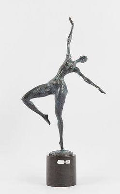 statue of a female dancer on a pedestal on a white background