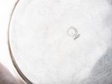 a silver plate that is sitting on a table
