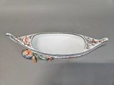 a white bowl with a floral design on it