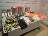 a table with a lot of items on it in front of a wall