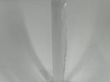 a clear glass candle holder with a candle on it