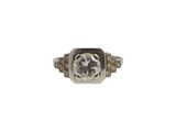 a close up of a diamond ring on a white background