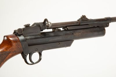 a close up of a gun on a white background with a white background