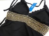 a black bikini top with gold chains on it